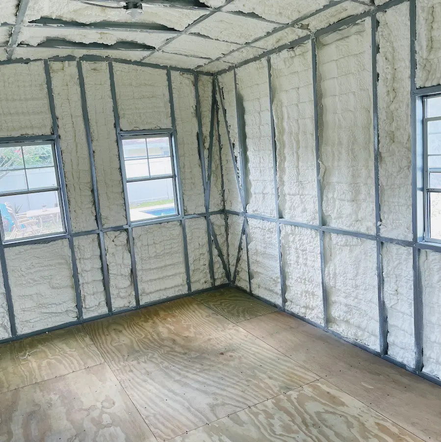 Closed-cell spray foam insulation applied to wall cavities in a residential project in Ramsey